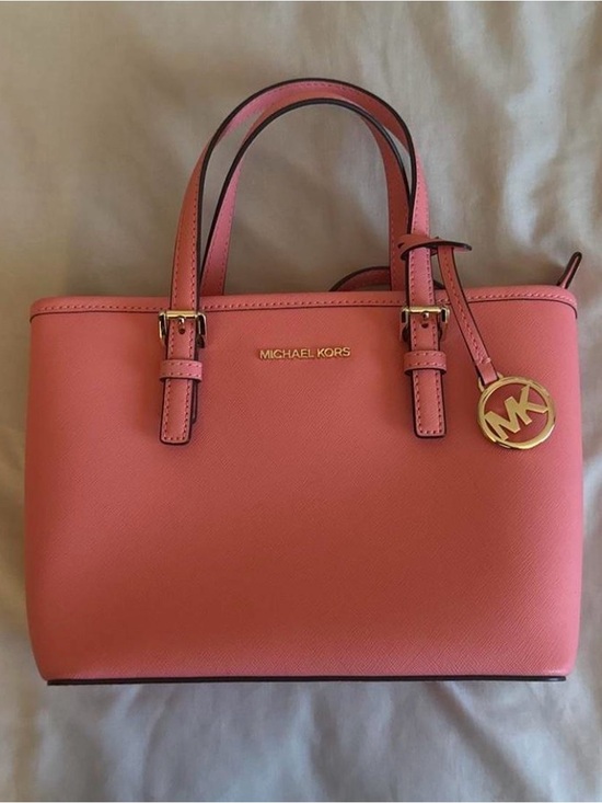 Michael Kors Handbags - Michael Kors Coral Pink Saffiano handbag with Gold Charm
